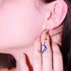 Boucles d’oreilles asymétriques Lunaria en acier inoxydable doré avec lune et zircon